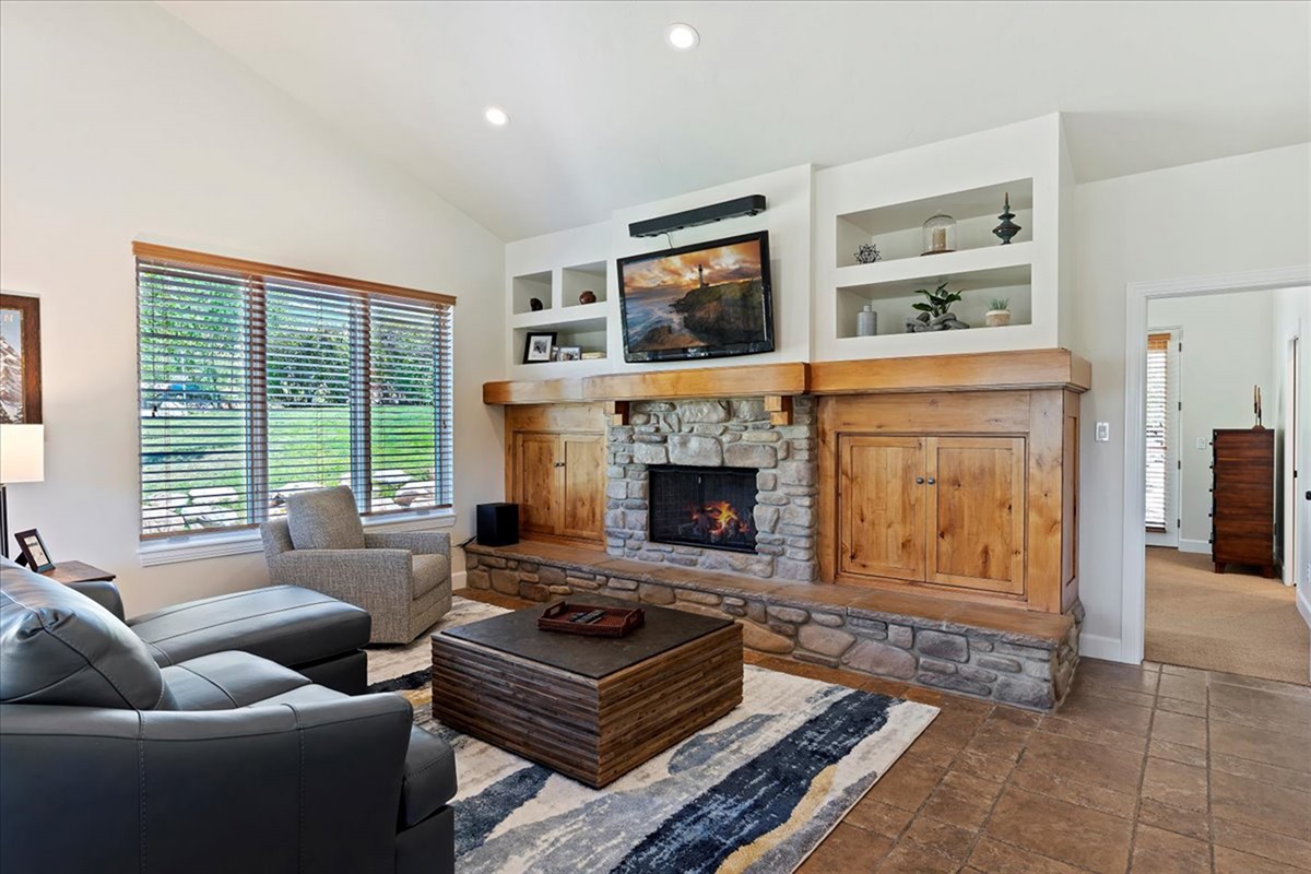 Settle in by the fire with a good movie or conversation—this inviting space was made for slow, cozy evenings.