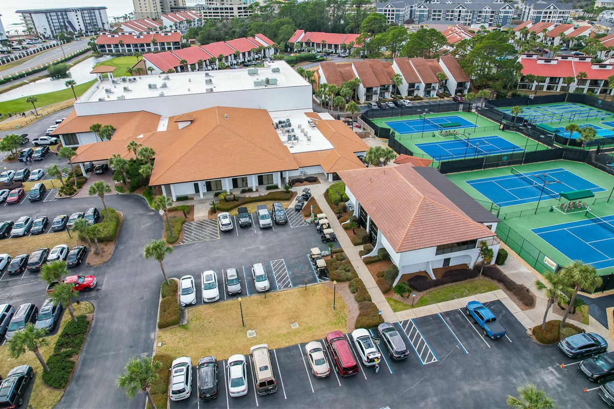 The Club at Edgewater—where you can workout in the fitness center upstairs, or reserve a tee time, or time on one of the many courts