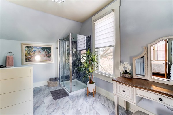 Full bathroom off the master bedroom with additional vanity area