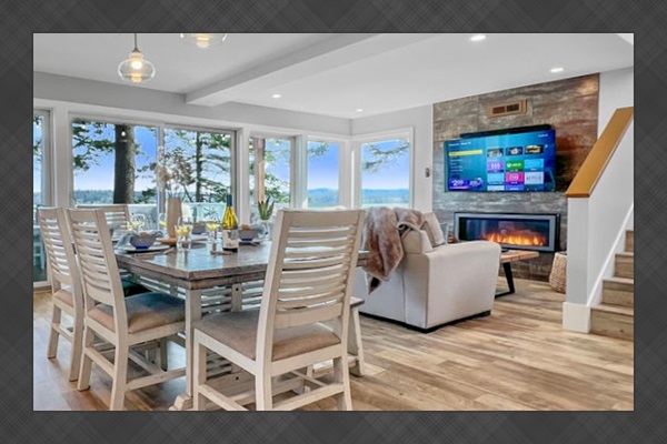 Enter Driftwood Dreams and the view hits you immediately - the open concept great room's floor-to-ceiling windows wrap you up in the water and mountain views.  This is where vacation truly starts to settle in.