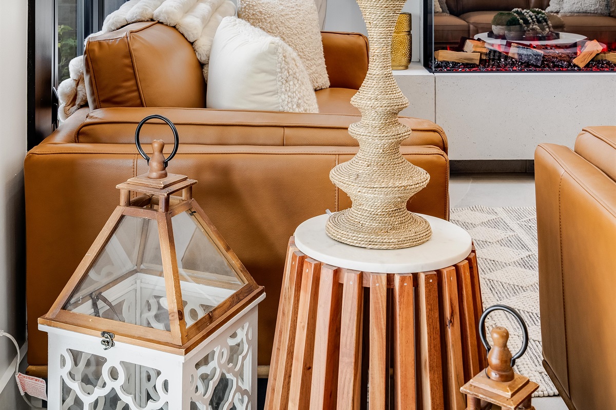 Orangish-brown accents in seating and cabinetry details create cohesion.