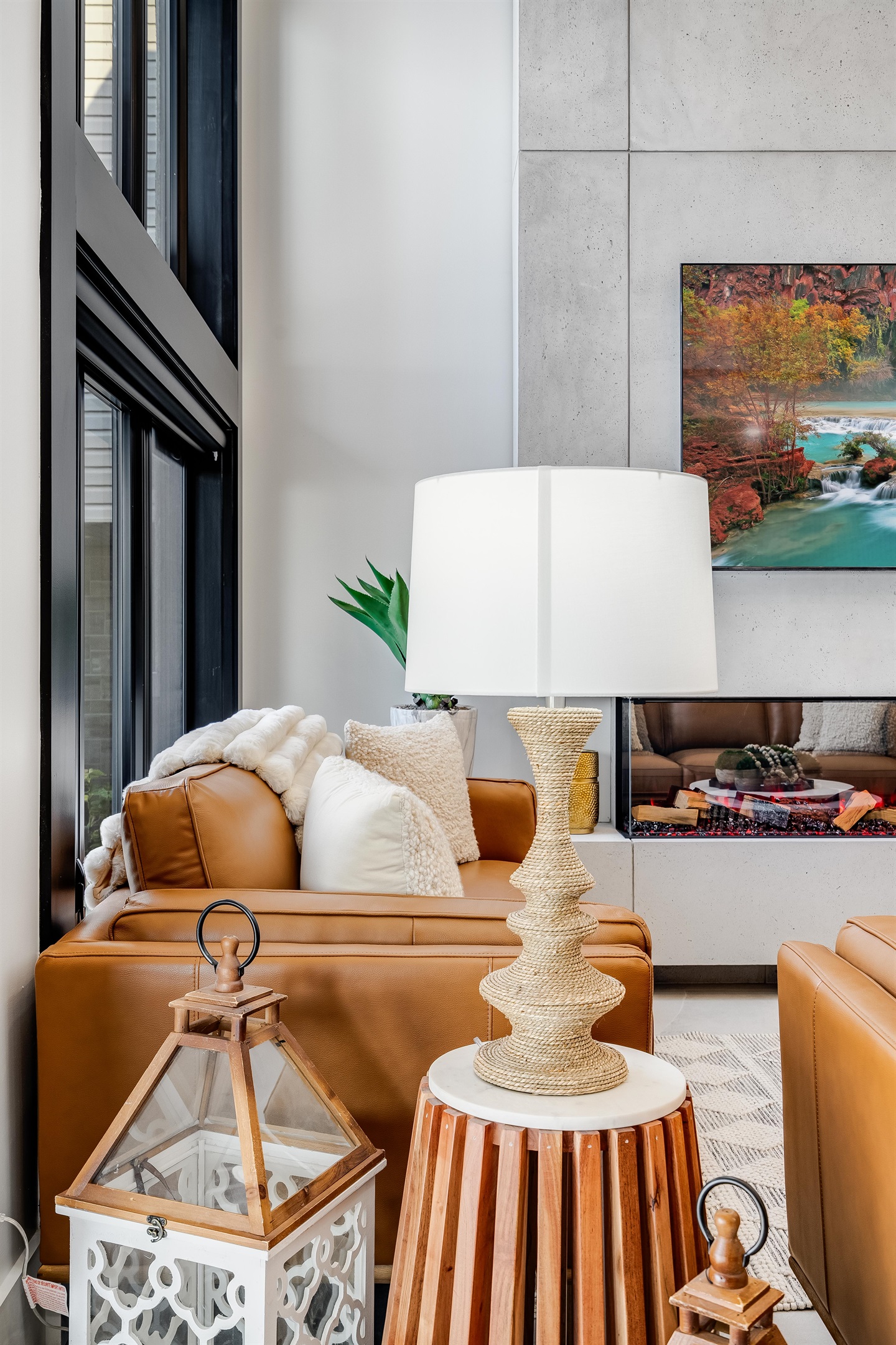 Orangish-brown accents in seating and cabinetry details create cohesion.