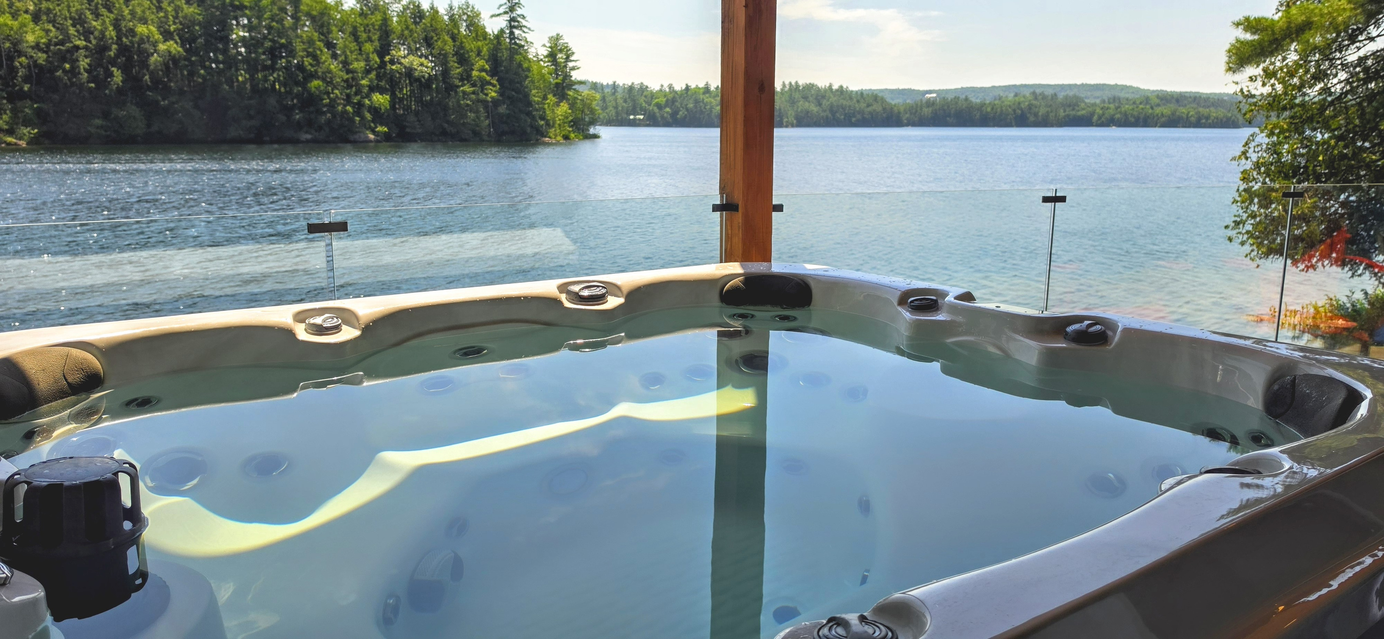 Relaxing hot tub waters with soothing view of Lac McGregor