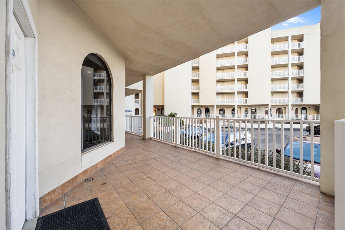 Ground-level covered patio with step-free access: an easy, open-air space right outside the unit, perfect for coming and going comfortably without stairs or elevators