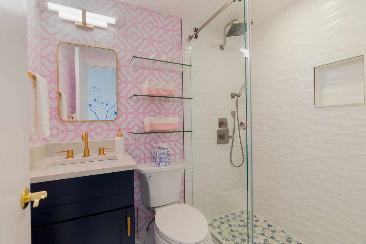 Spoonflower pink wallpaper with gold accessories.