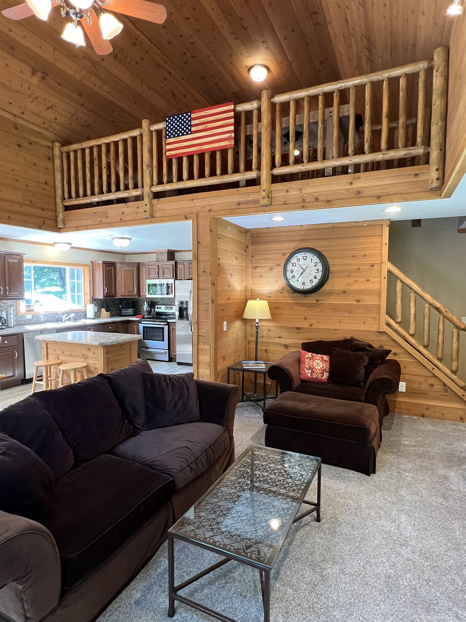Living area with loft game room above