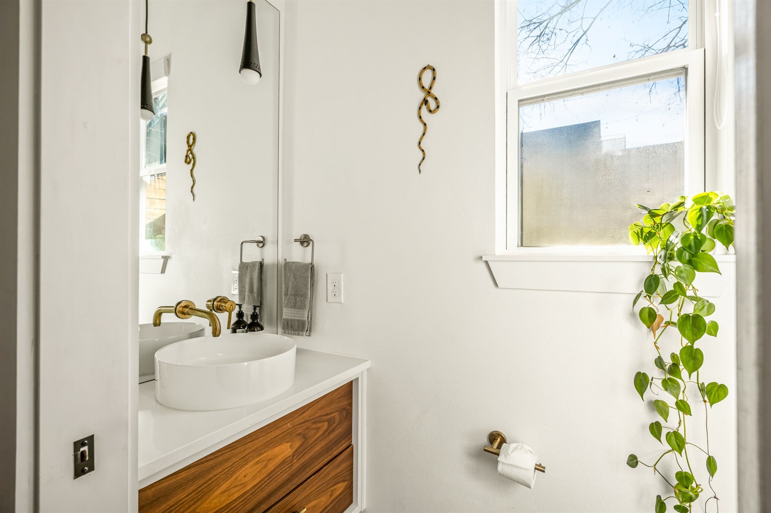 Charming bathroom with a stylish vanity and natural light