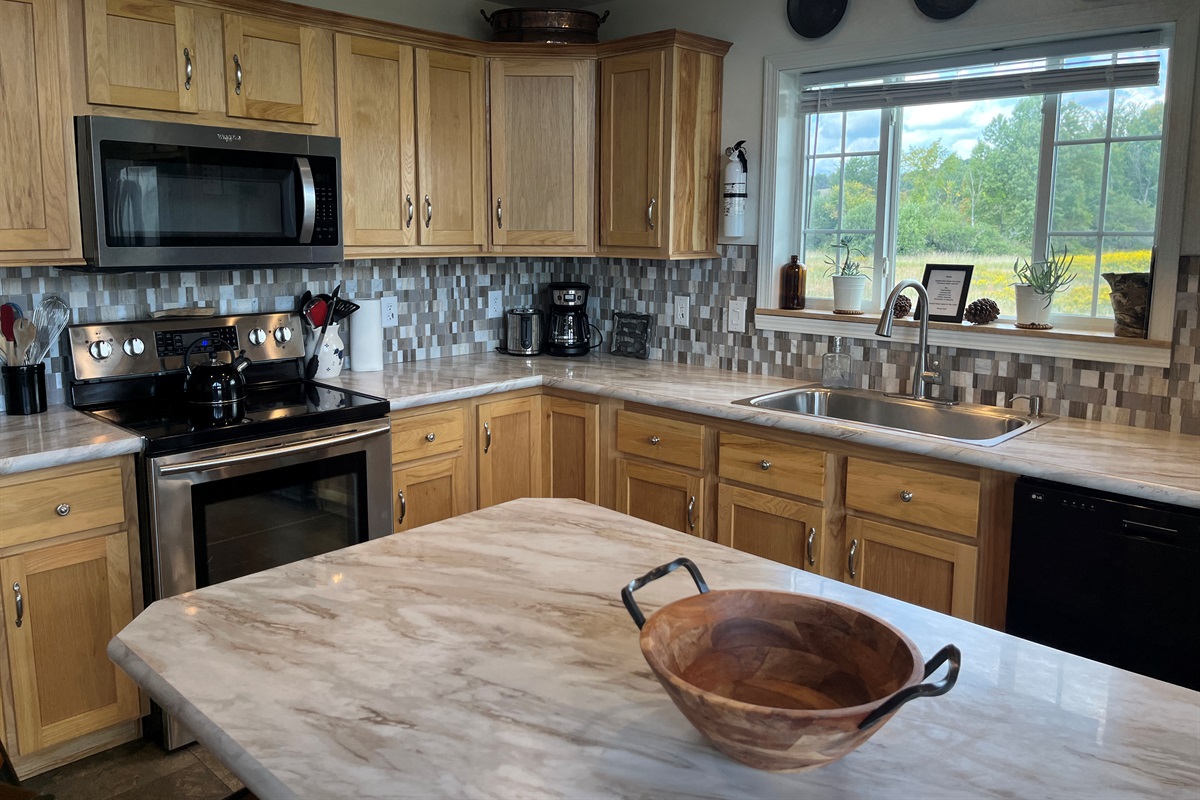 New kitchen with stainless steel applicances