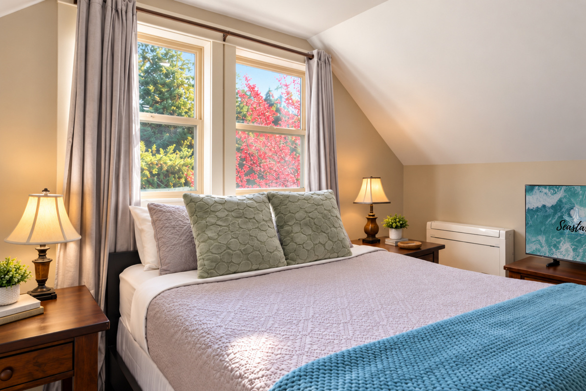 Cozy loft private bedroom with a queen bed, TV and ensuite