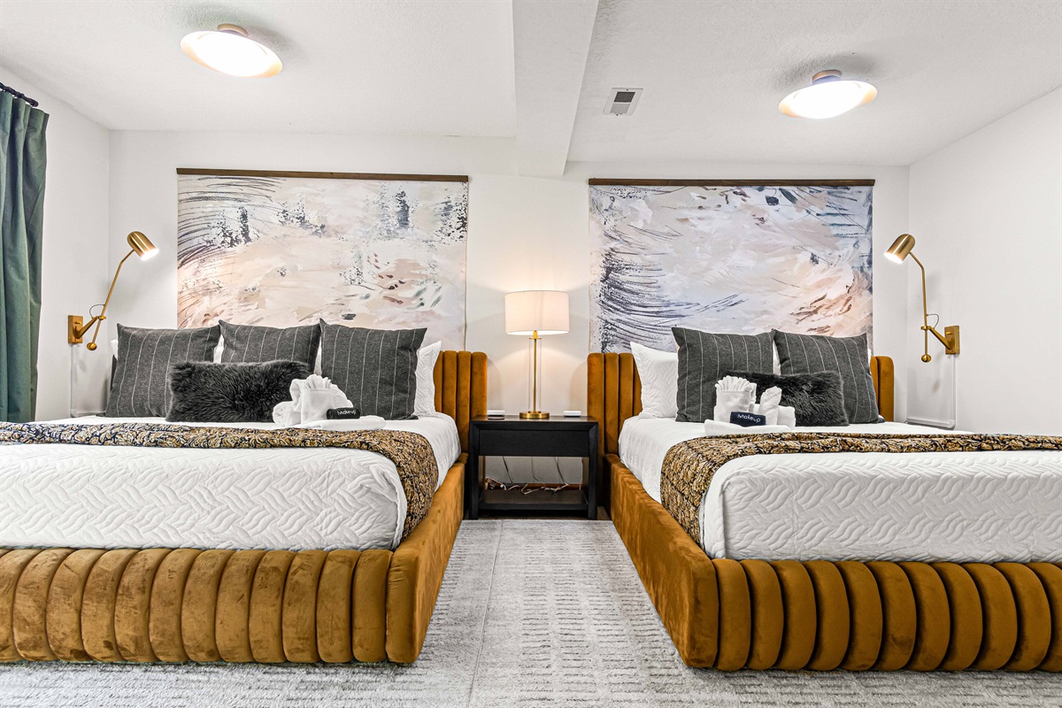 Inviting lower-level retreat with a king and queen bed—perfect for families or friends to unwind in comfort. 🛏️✨