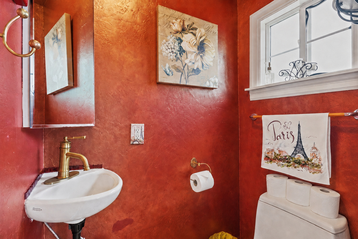 Convenient half bath with sink and toilet.