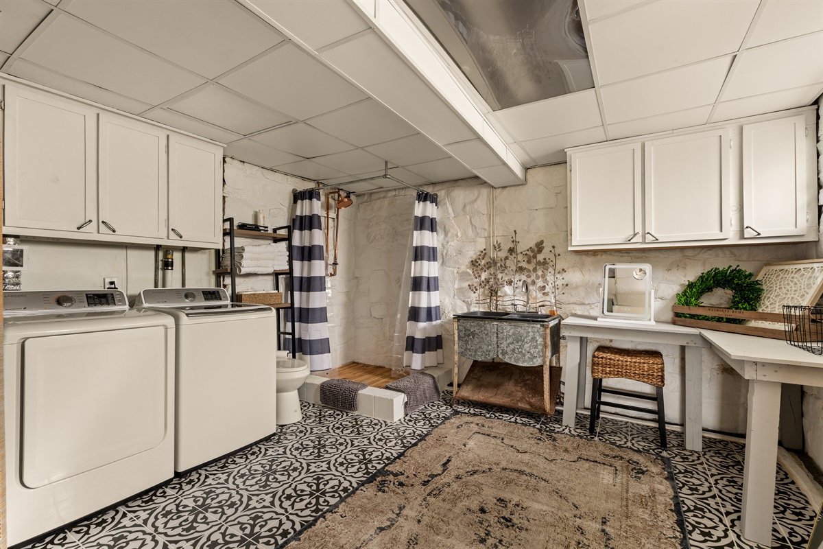 A unique lower-level retreat with full bath, in-home laundry, and a dedicated getting-ready space.