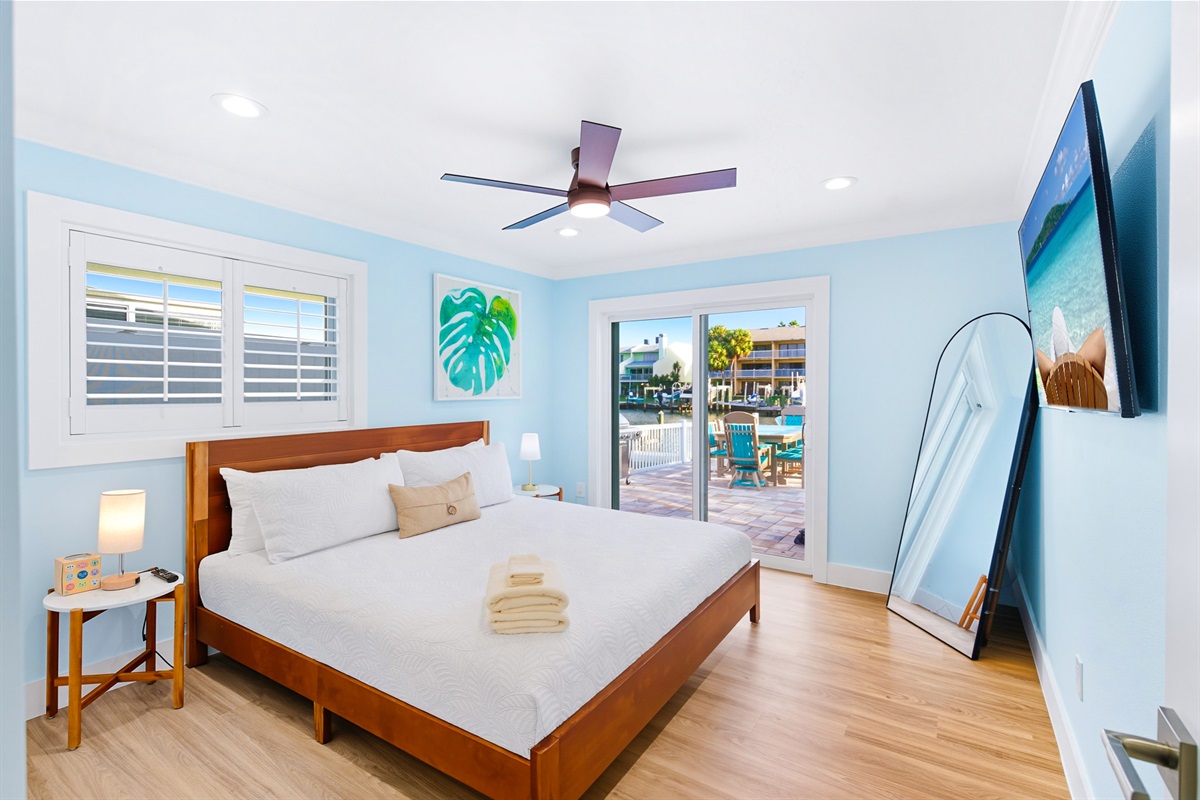 Bedroom 2 offers a king bed, smart TV and water view.