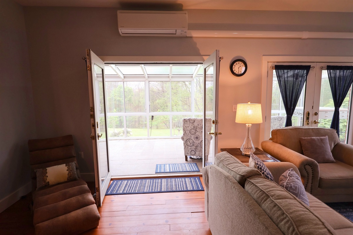 French doors open into the sunroom
