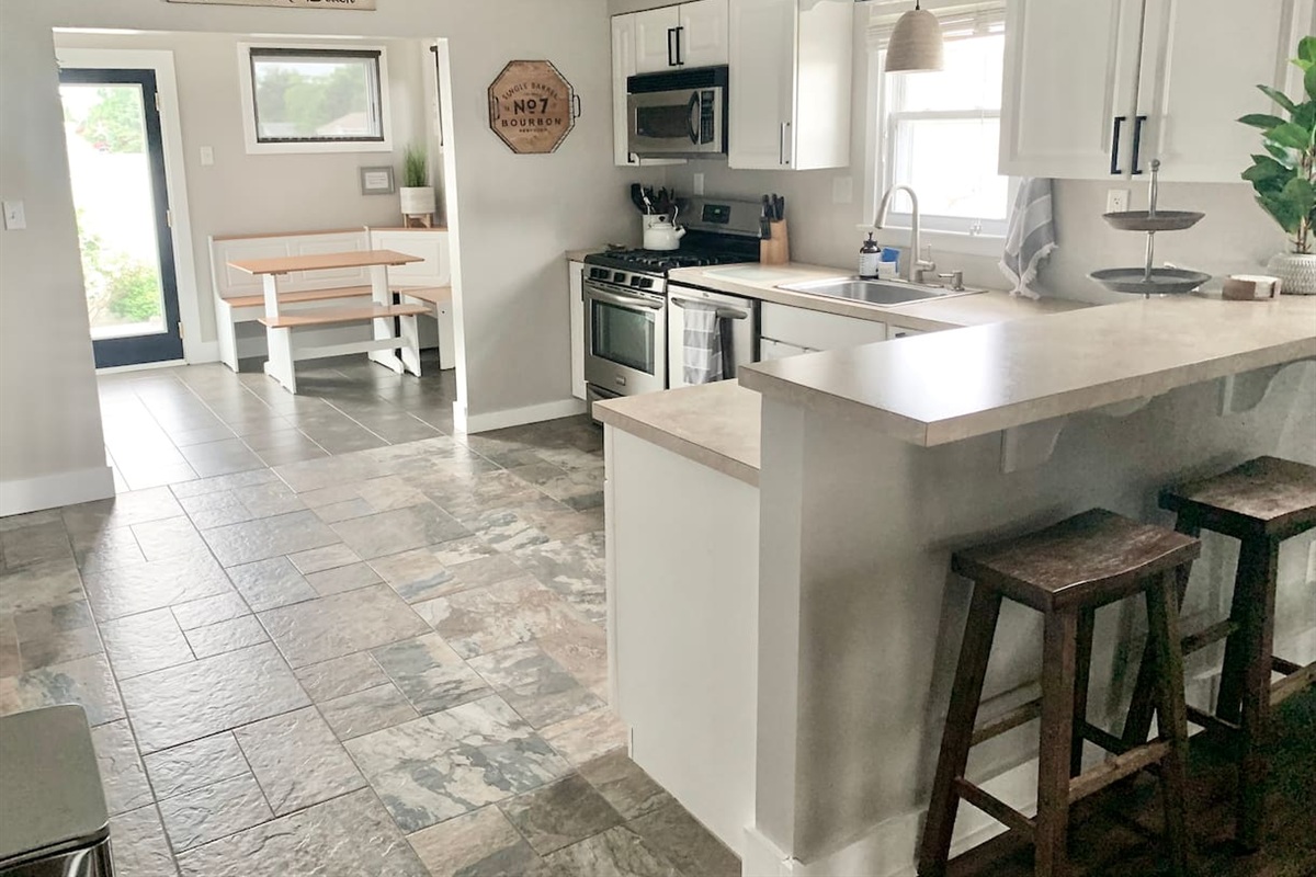 Cook meals in this bright kitchen with stainless appliances and a breakfast bar. This well-appointed area includes a cozy corner nook, making it easy to enjoy a quick bite before heading to the beach.
