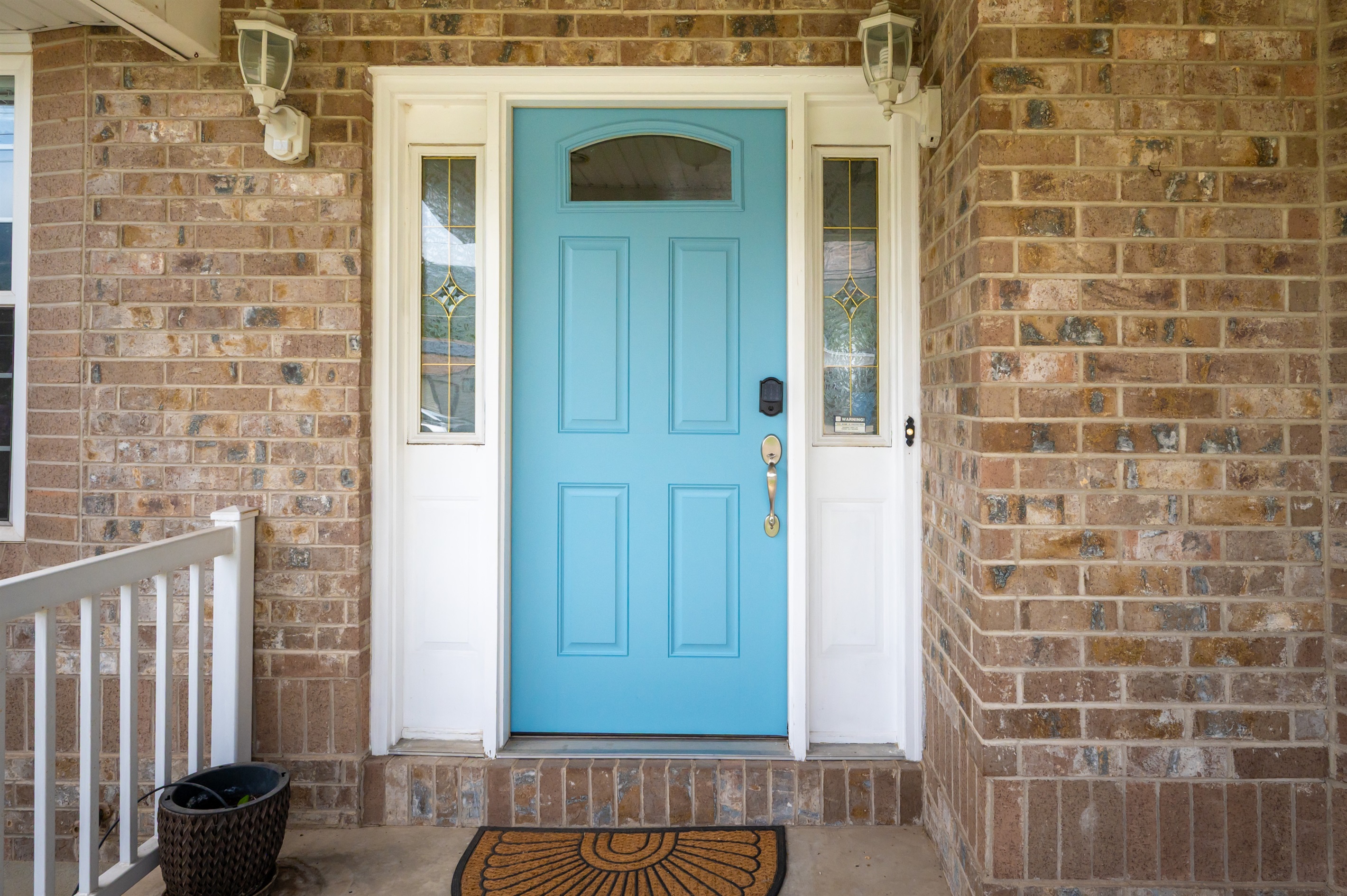 Charming front entrance featuring a cheerful blue door and smart lock entry for easy self check-in.