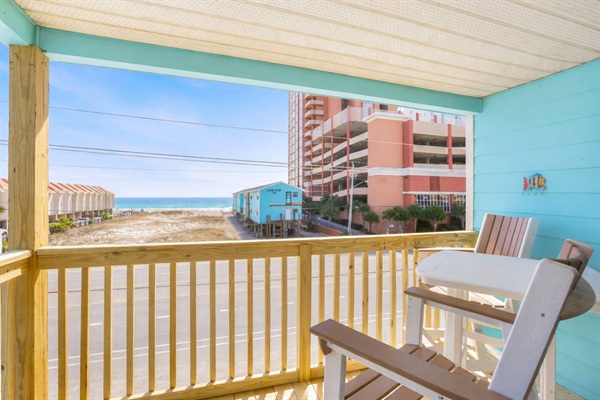 Brand new balcony with seating for 2, bar height table and 2 stools.