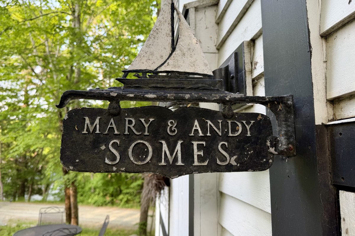 A historic nod at the entrance to the Settler's Sidecar. This antique sign honors the Somes family—the original founders of Somesville who still proudly own this home today. Stay in a true, unaltered piece of Mount Desert Island heritage.