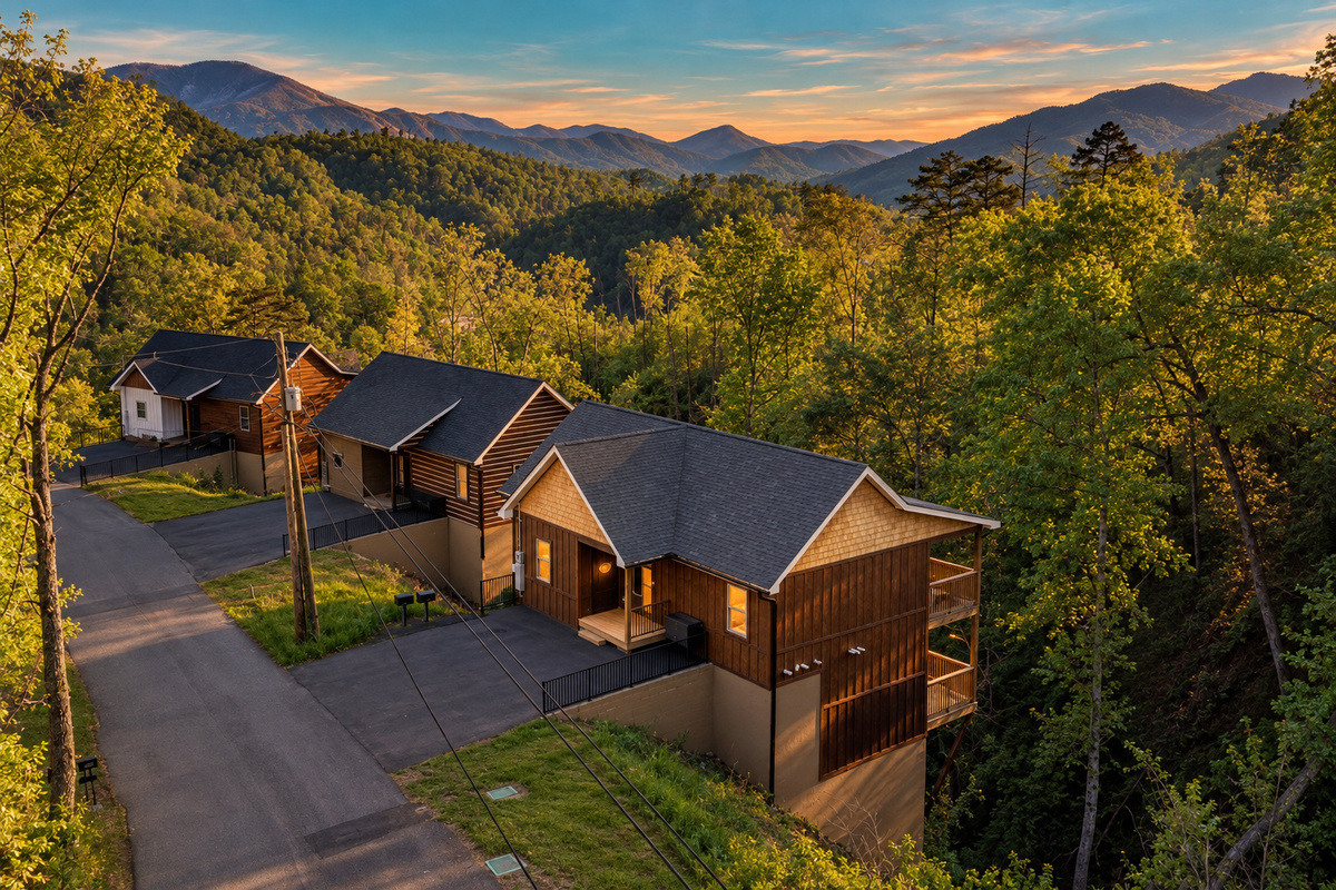 Perched on a wooded hillside with layered peaks stretching to the horizon.