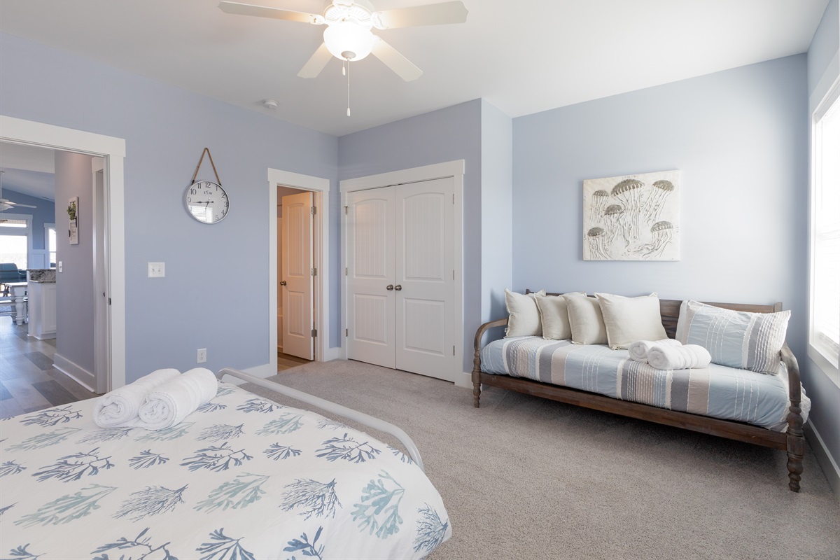A cozy Twin bed tucked into the Top floor bedroom, offering a comfortable sleep space alongside the Queen bed.