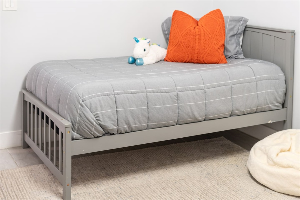 Bold artwork and a plush unicorn bring personality and fun, making this an ideal space for younger guests.
