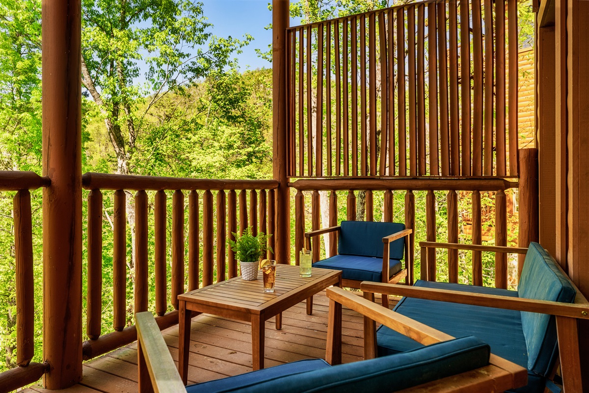 With cozy seating available, the porch is a perfect place for a moment of relaxation in the beauty of nature.