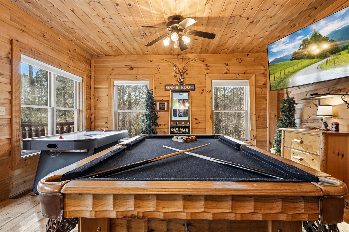 Ultimate cabin game room with pool table, air hockey, Pac-Man arcade machine & flat screen TV near Gatlinburg TN | Great Smoky Mountains family vacation rental with full arcade near Pigeon Forge & Sevierville | The most fun cabin game room in the Smokies