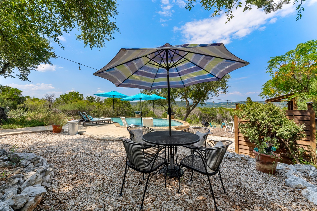 A shady patio for afternoon stillness or evening chats with a breeze.