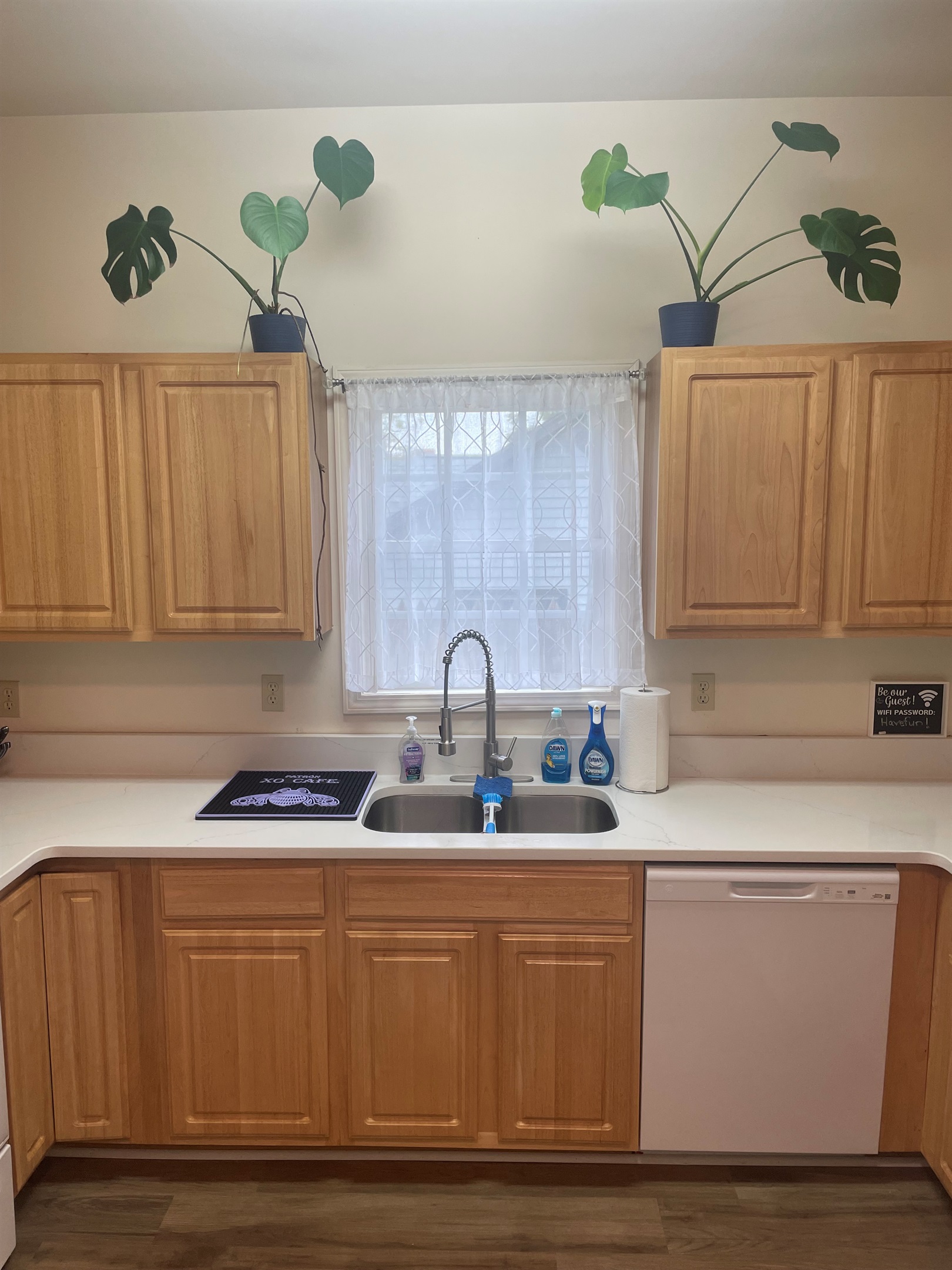 The open concept kitchen adorned with lots of natural light welcomes you from your travels. 