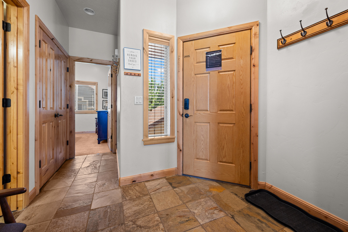 Spacious foyer provides easy access to bedrooms, living spaces, and outdoor adventures.