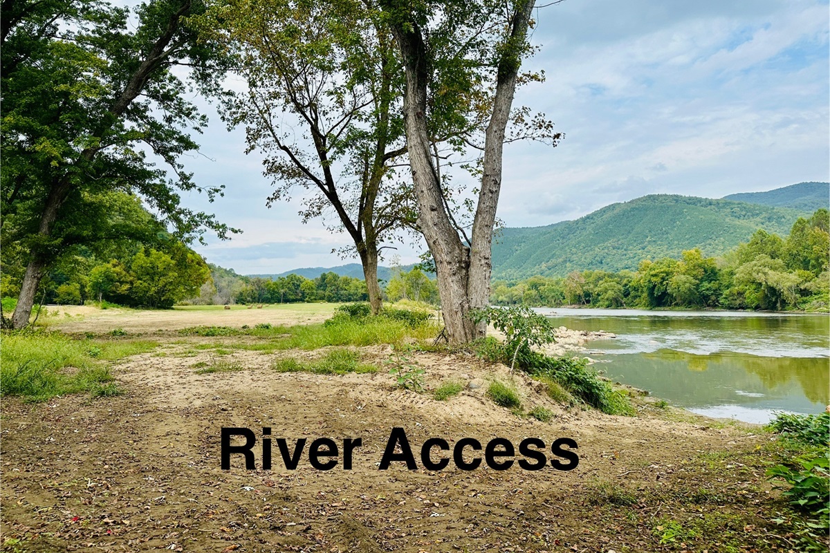 To access the river, walk over the railroad crossing into a large field. The walk down to the river is on the far right of the field. 