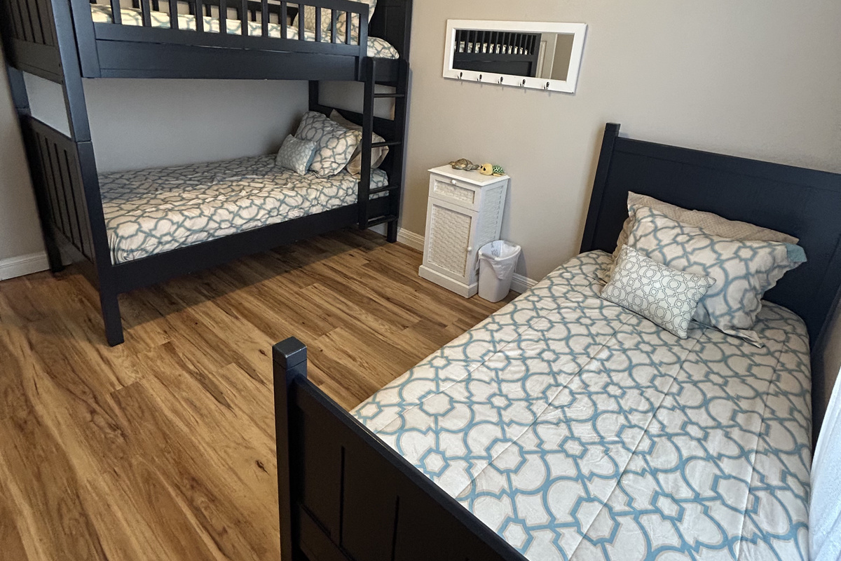 Bunk room with 4 twin beds.