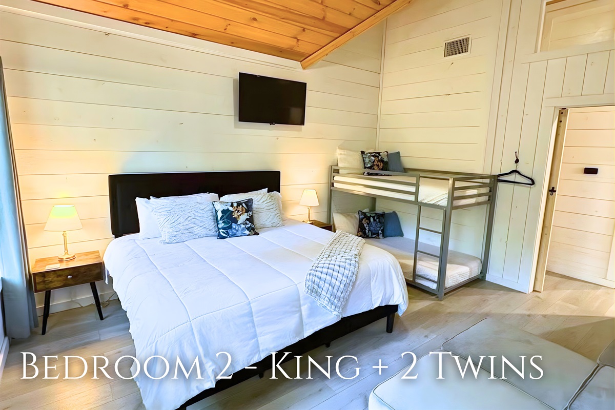 Bunk up in style! Our comfy second bedroom with a king bed and twin bunks is perfect for kids or friends sharing stories.