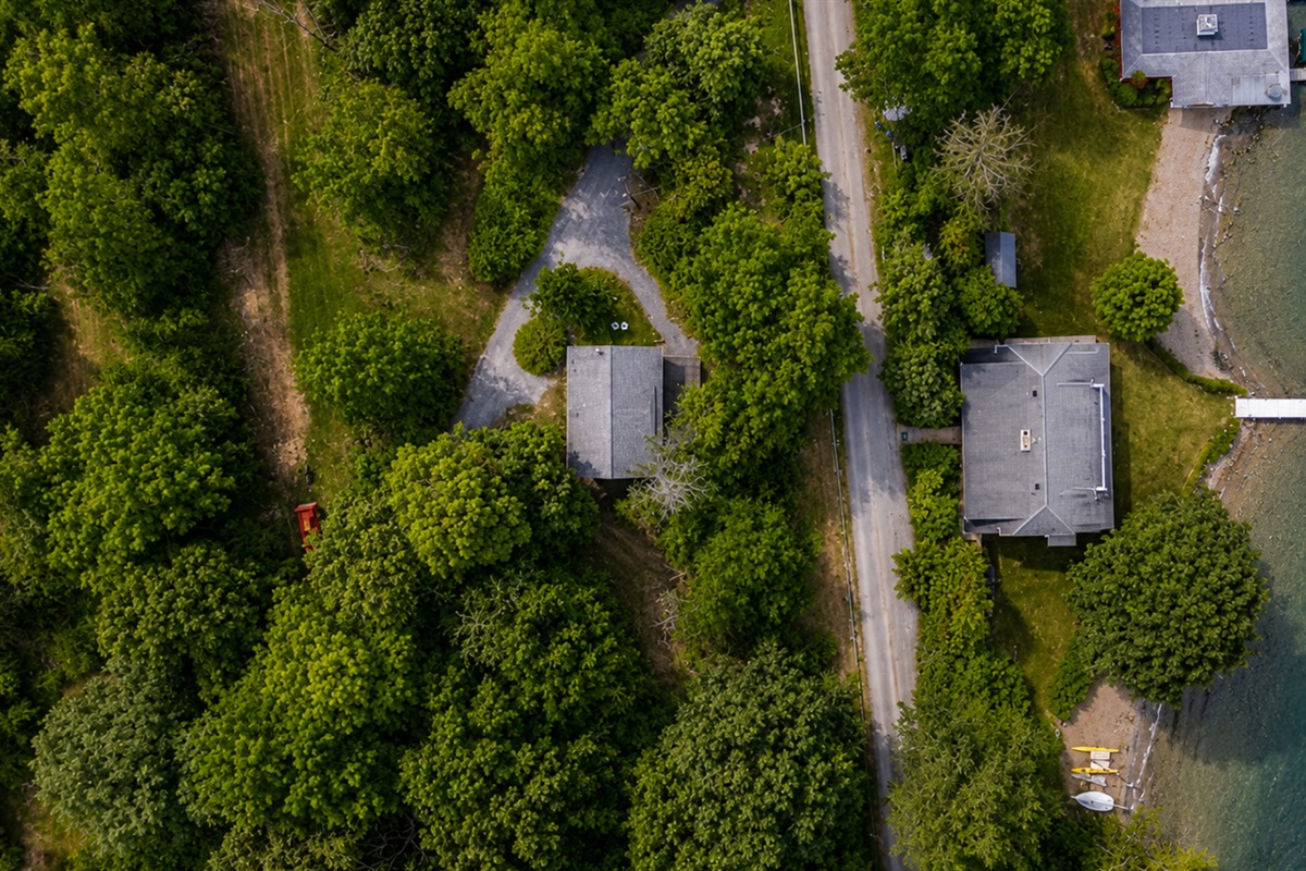 Bird’s-eye view of the property. Please note the bigger house with the dock is not part of this property
