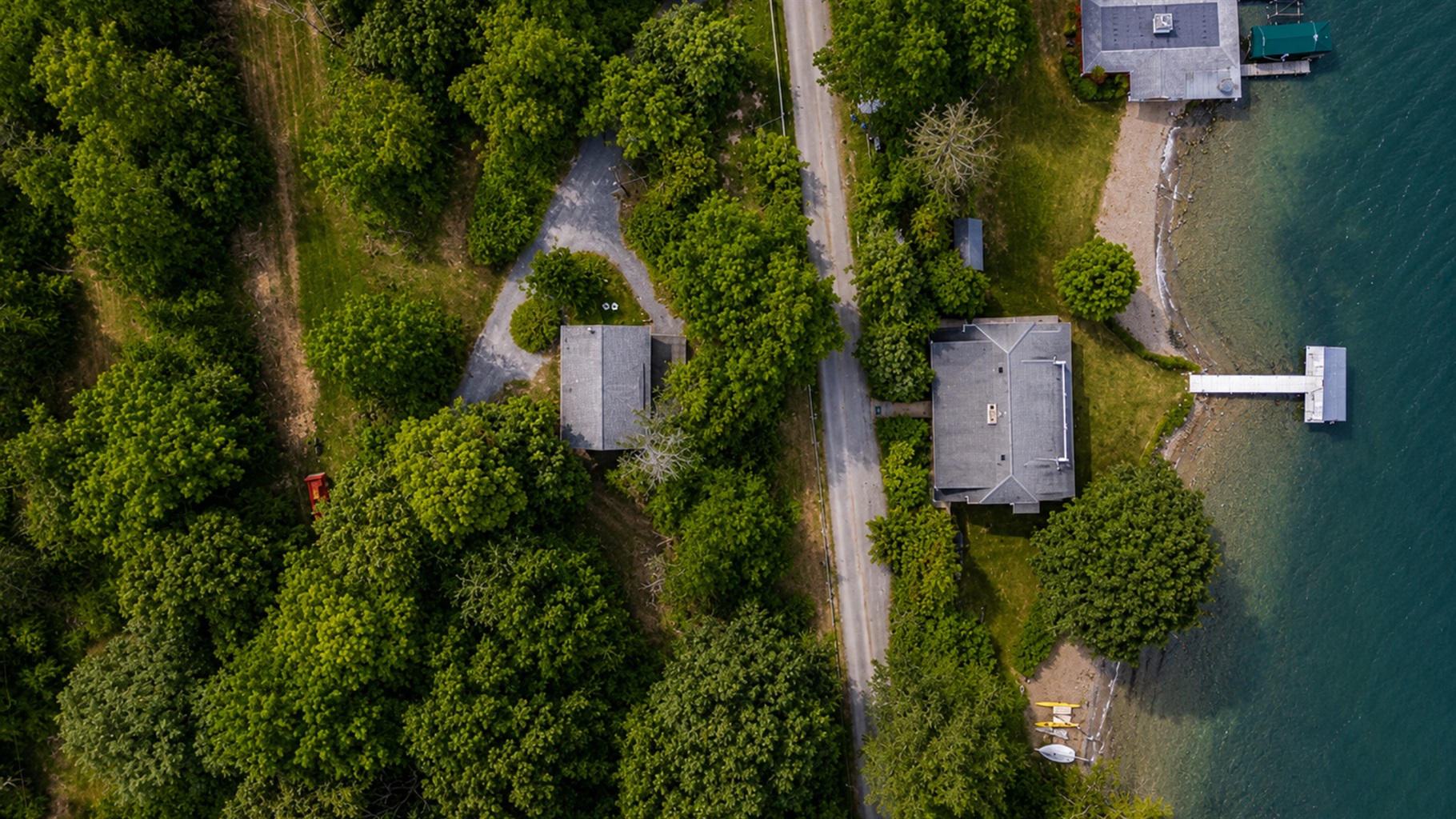 Bird’s-eye view of the property. Please note the bigger house with the dock is not part of this property