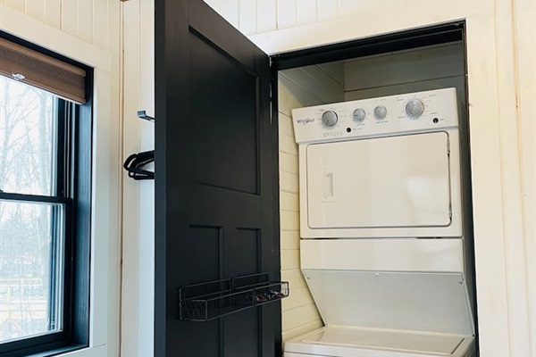 The laundry facilities are in a closet located in bedroom number one.