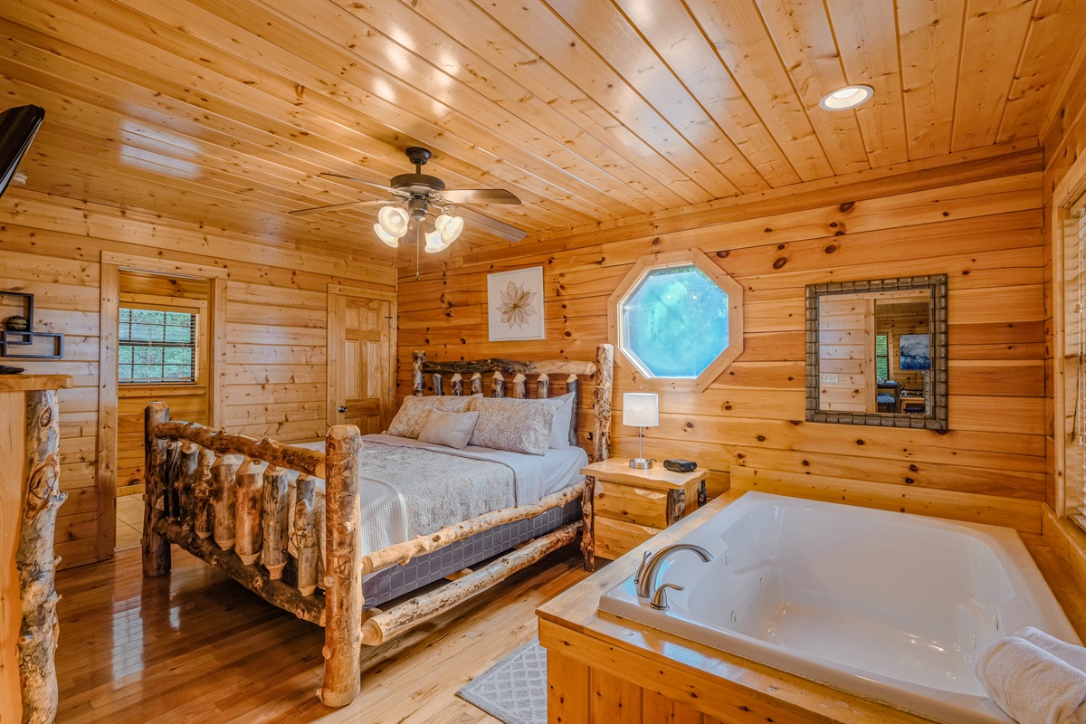 Master bedroom on main floor with king bed and jacuzzi