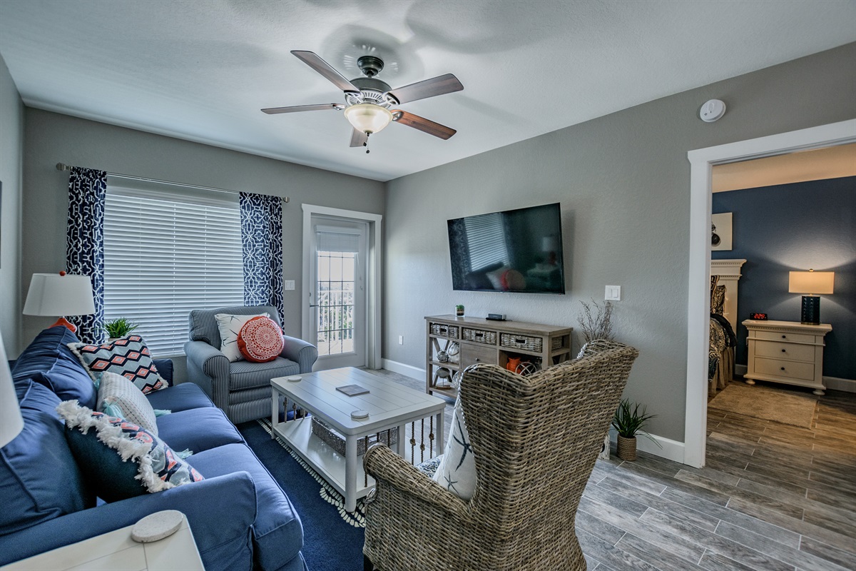 View of the living area from the dining area - opens up to a balcony that overlooks the Intracoastal