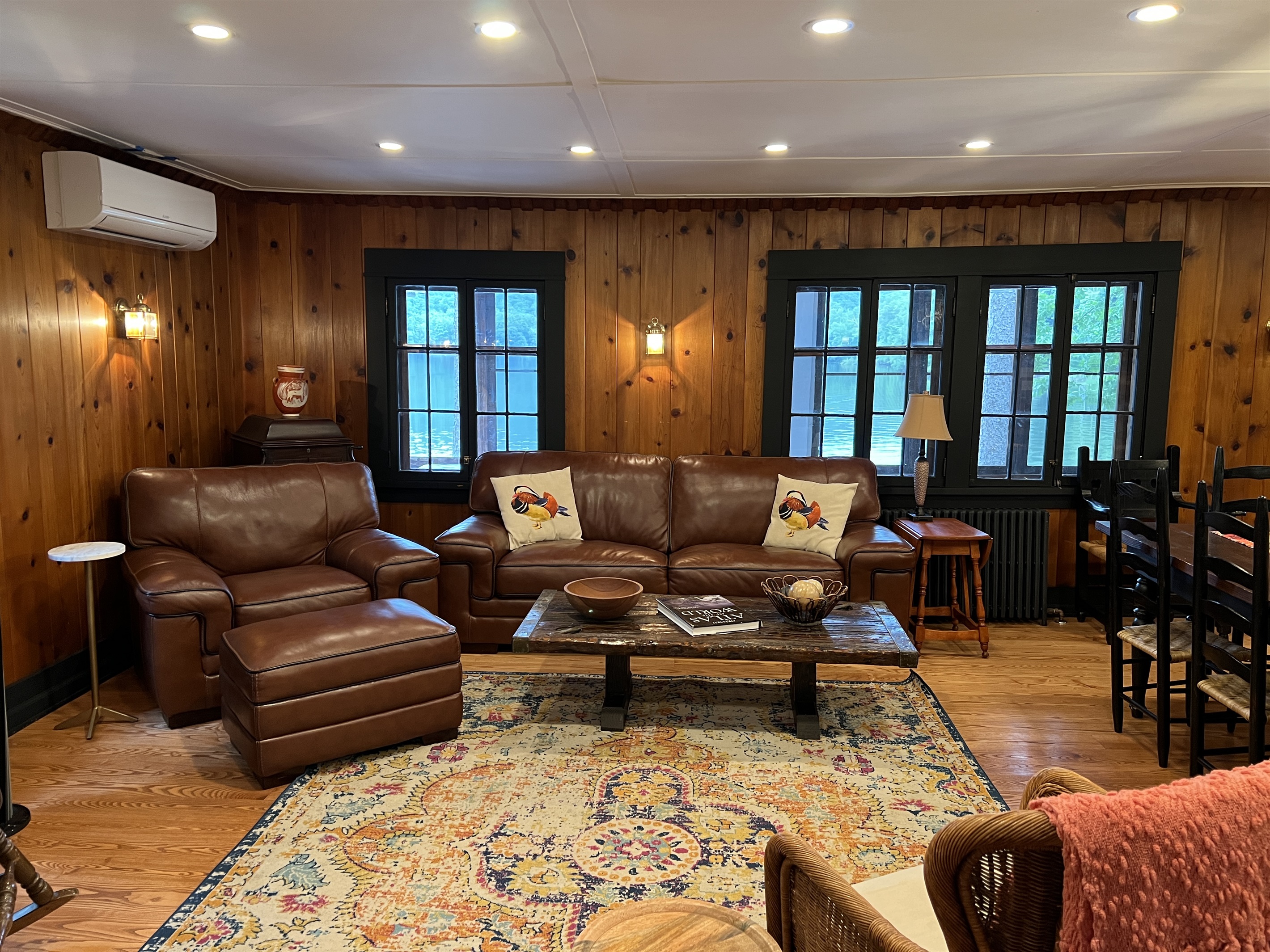 Leather seating in the living room overlooking the lake.