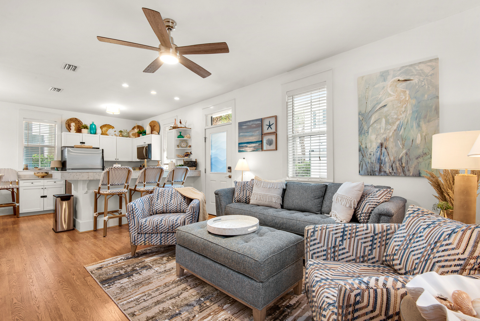 Seagrove Bungalow 103 living area with sectional seating and an open kitchen in Seagrove Beach, Florida.