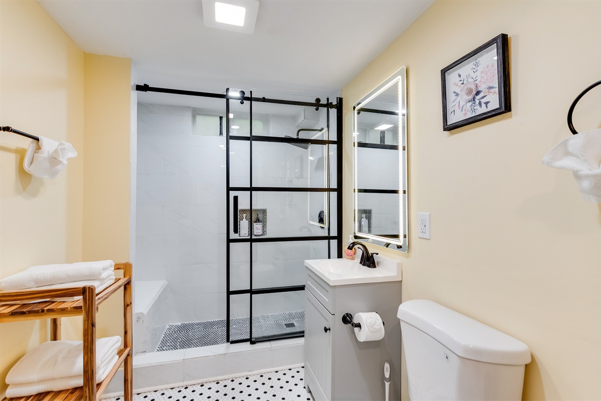 Downstairs Bathroom 3: Stylish space with sleek finishes and a spacious shower for ultimate relaxation!