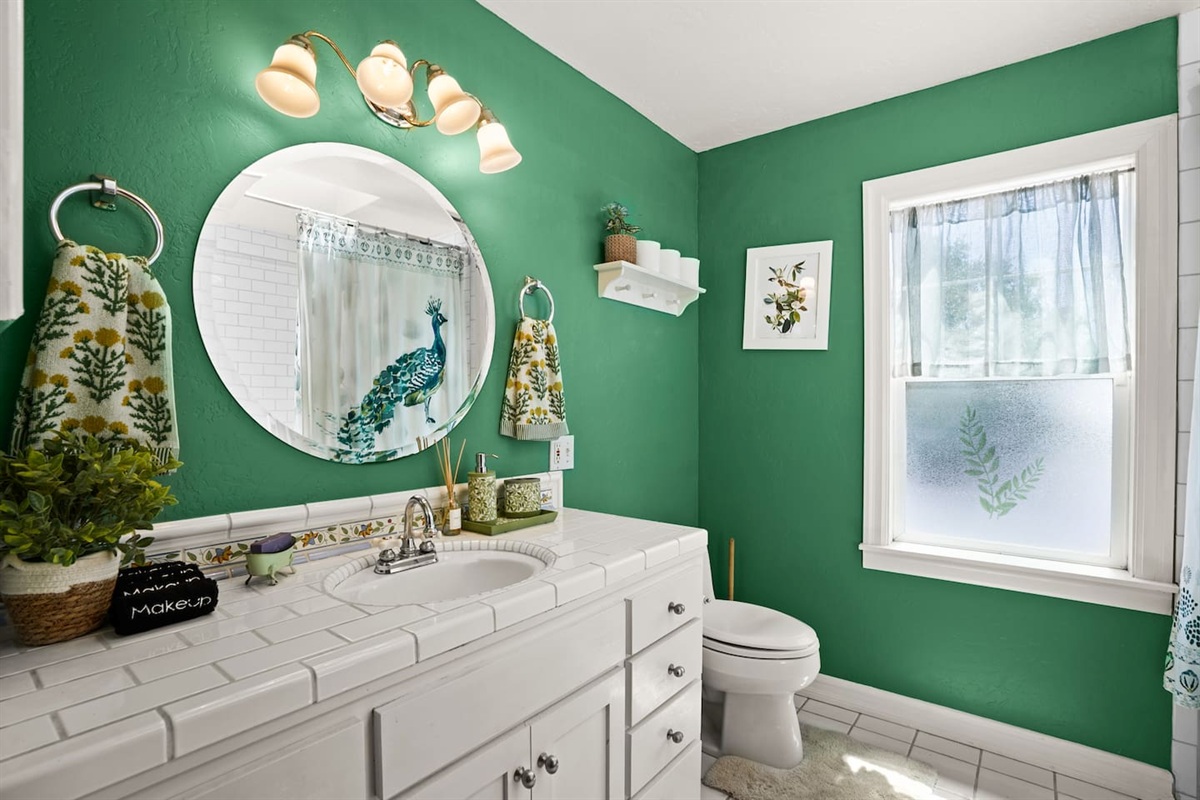 Bright main bathroom with a skylight for beautiful natural light.