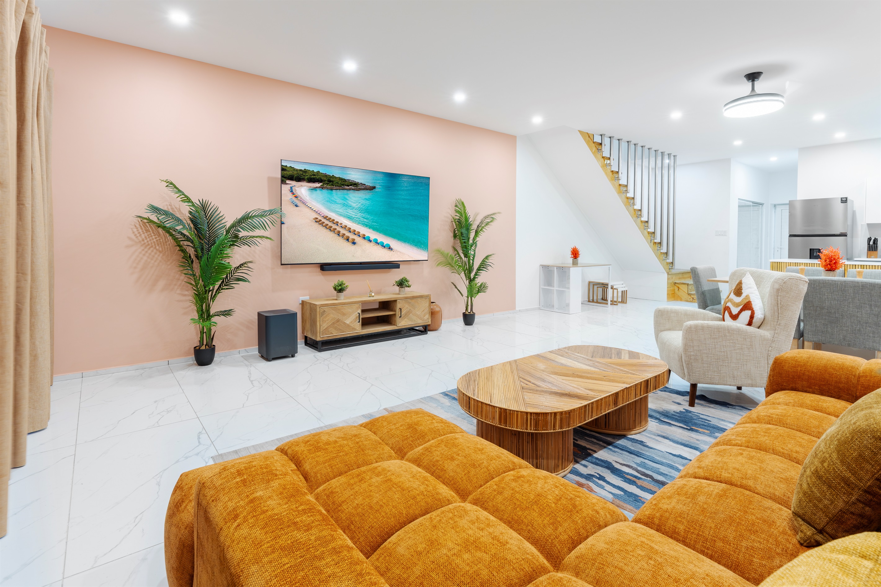 Comfortable lounge area with plush sectional seating and warm coastal styling