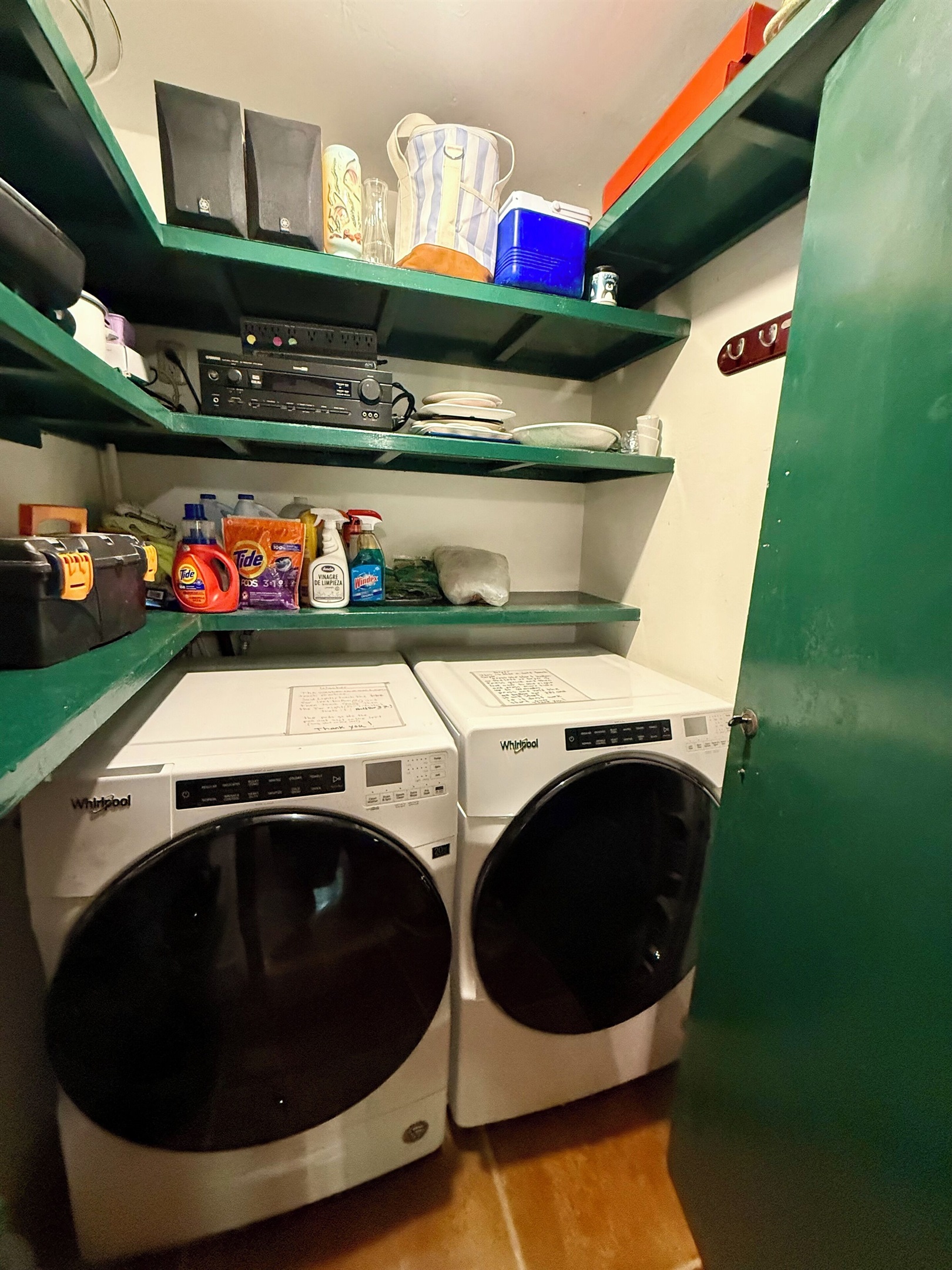 Indoor laundry room and pantry with double doors to secure valuables 