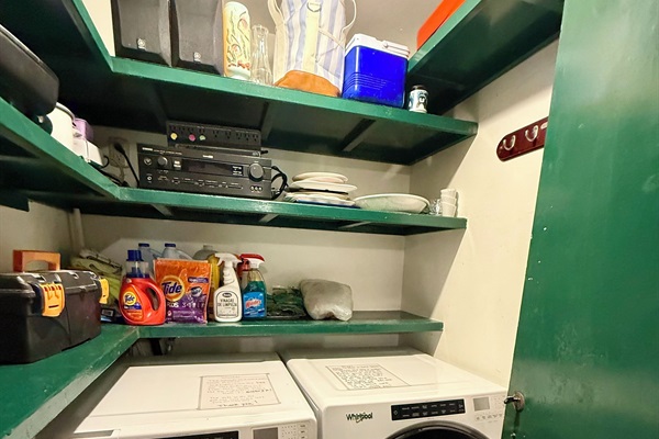 Indoor laundry room and pantry with double doors to secure valuables 