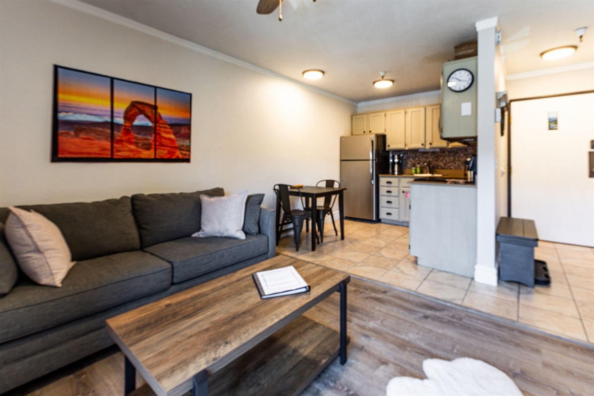 Comfy seating area, kitchen with dining / work space.