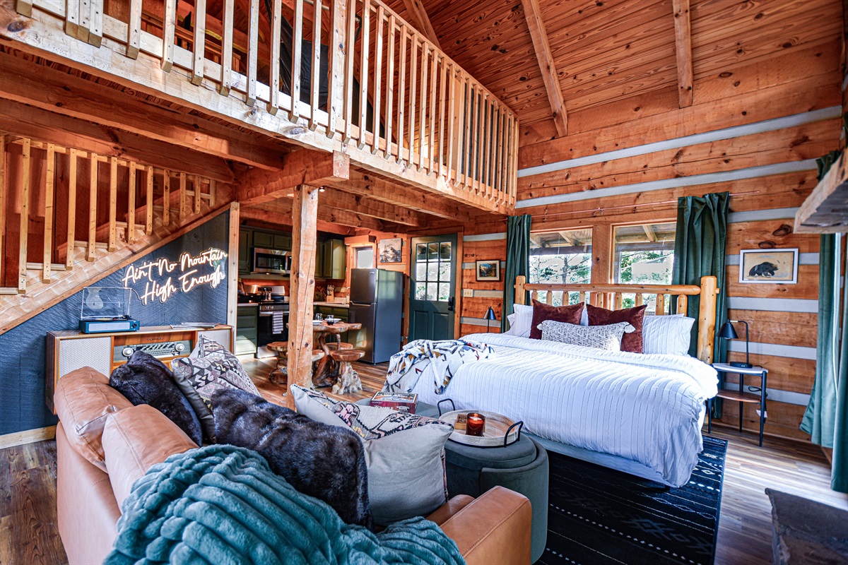 Explore the cabin's second sleeping area, the game/bunk loft and half bathroom upstairs. The open layout gives plenty of room to relax and take in the magic of the Smokies.