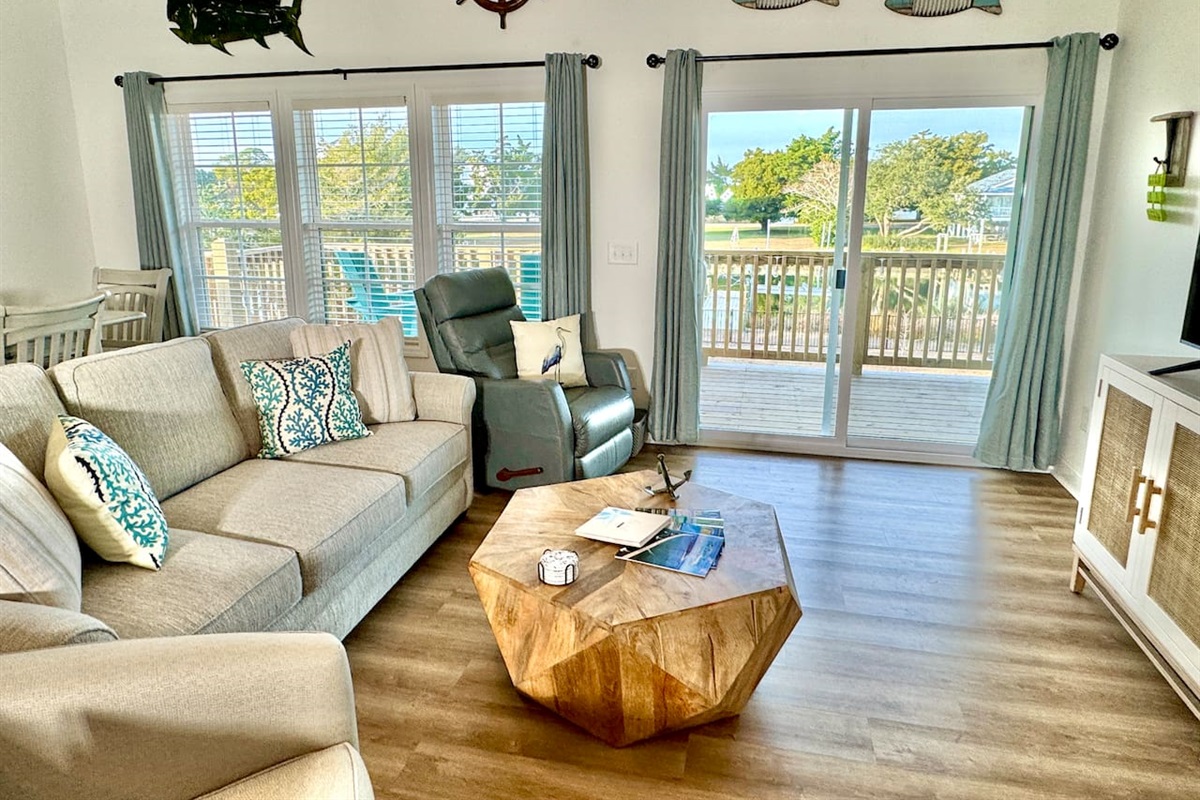 Get cozy while you relax in this living room with a water view. Sofa bed features a Queen mattress. 