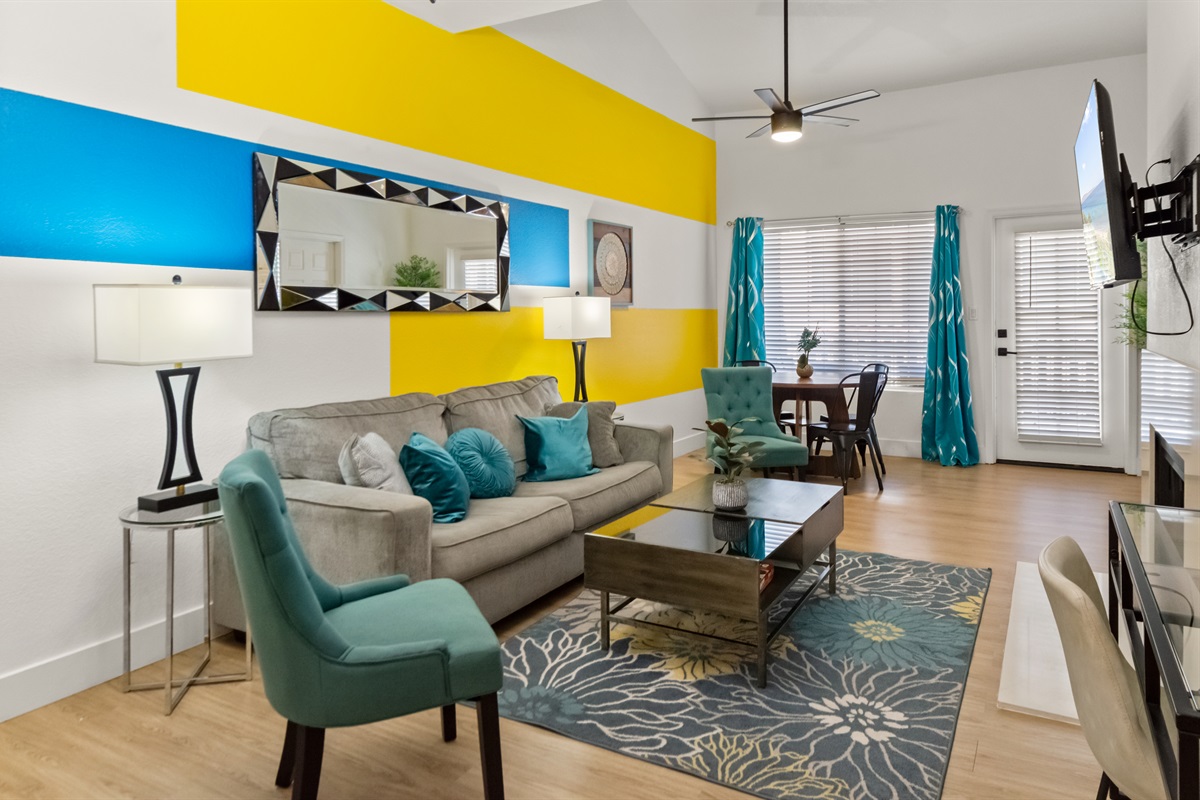 Cozy living room with plenty of natural light and comfortable seating
