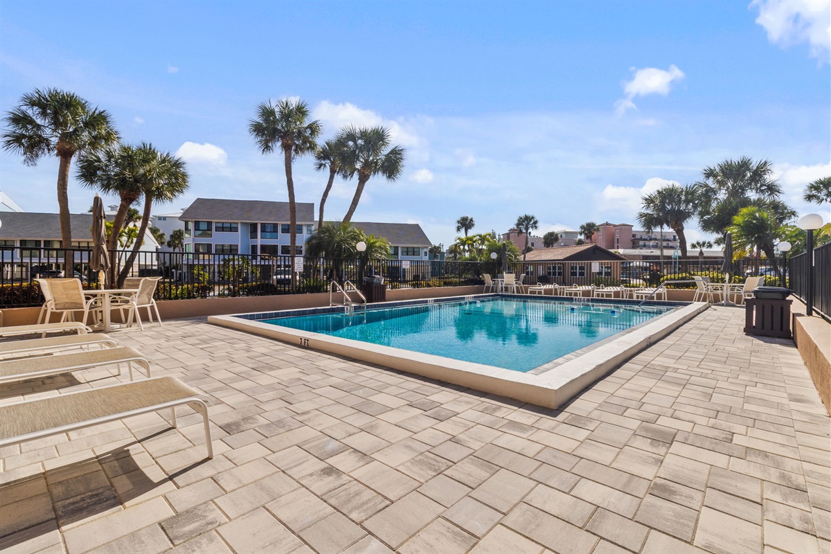 Heated pool is just steps away from the unit.